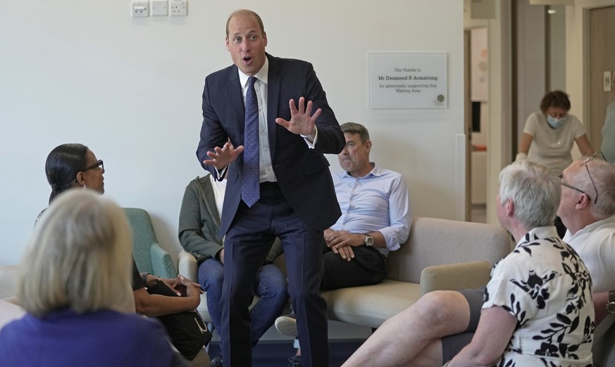 Britain&#039;s Prince William, center, chats with the outpatients as he attends the official opening of the Oak Cancer Centre at The Royal Marsden Hospital in London, Thursday, June 8, 2023. (AP Photo ...