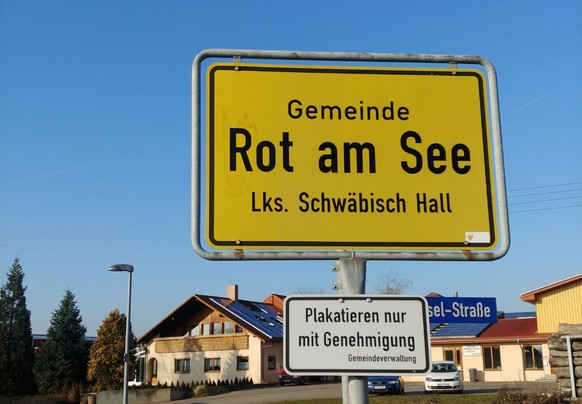 A town sign is pictured on a street in Rot am See in southwestern Germany where where several people were injured and some presumed dead in a shooting, January 24, 2020. REUTERS/Oliver Stroebel