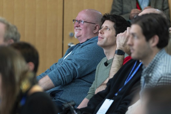 Microsoft Chief Technology Officer Kevin Scott, left, and OpenAI CEO Sam Altman watch a presentation introducing the integration of the Bing search engine and Edge browser with OpenAI on Tuesday, Feb. ...