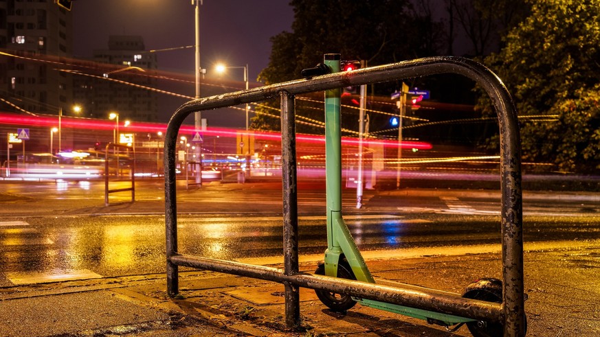 electric scooter on a rainy night city street