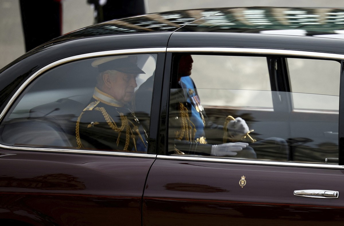 King Charles III and Prince William are driven to Westminster Abbey for the funeral of Queen Elizabeth II, in London, Sept. 19, 2022. (Sarah Meyssonnier/Pool Photo via AP)