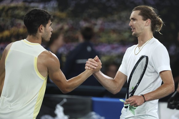 Alexander Zverev, right, of Germany is congratulated by Carlos Alcaraz of Spain following their quarterfinal match at the Australian Open tennis championships at Melbourne Park, Melbourne, Australia,  ...
