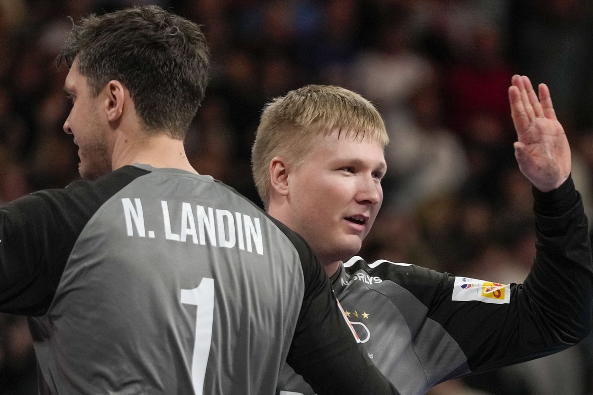 Denmark&#039;s goalkeeper Emil Nielsen, right, and Denmark&#039;s goalkeeper Niklas Landin Jacobsen celebrate at the end of the Men&#039;s European Handball Championship match between Denmark and Czec ...