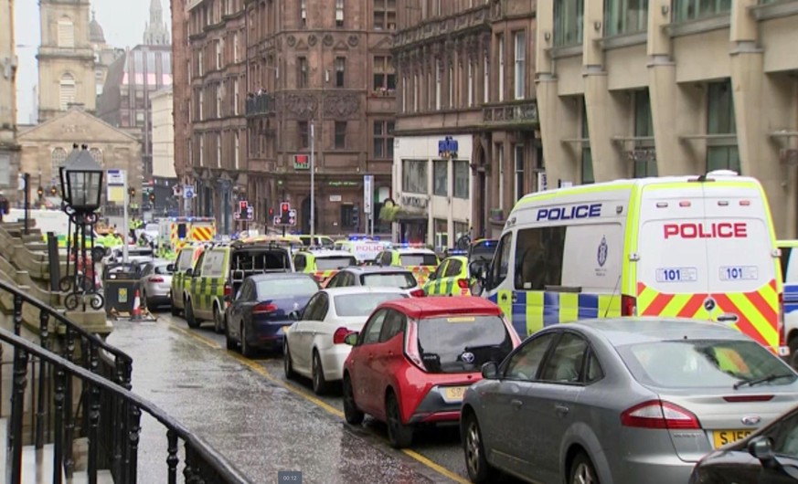 In this image taken from SKY video, emergency services attend the scene of incident in Glasgow, Scotland, Friday June 26, 2020. Police in Glasgow say emergency services are currently dealing with an i ...