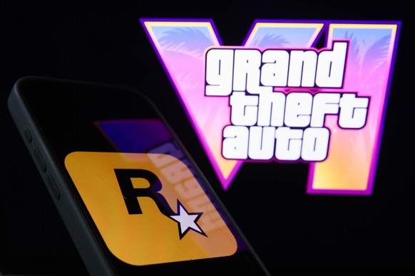 GTA VI Photo Illustrations GTA VI logo from the trailer displayed on a laptop screen and Rockstar Games logo displayed on a phone screen are seen in this illustration photo taken in Krakow, Poland on  ...