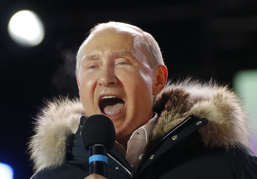 In this March 18, 2018 photo, Russian President Vladimir Putin speaks to supporters during a rally near the Kremlin in Moscow. The tempest over President Donald Trump&#039;s congratulatory phone call  ...