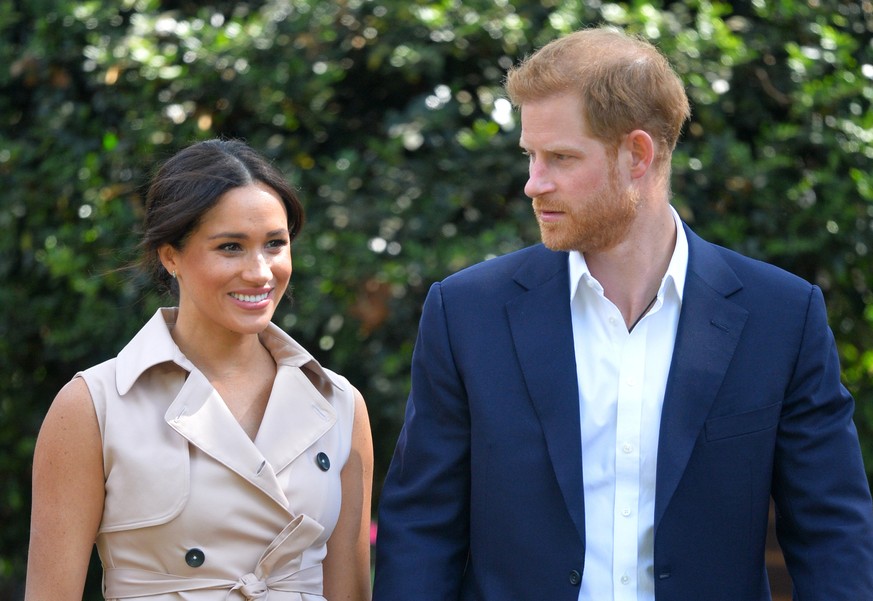FILE - In this Oct. 2, 2019, file photo, Britain's Harry and Meghan, Duchess of Sussex arrive at the Creative Industries and Business Reception at the British High Commissioner's residence in Johannes ...
