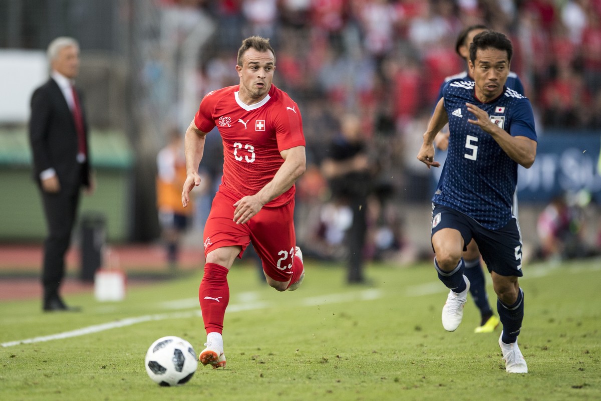 Switzerland&#039;s Xherdan Shaqiri, left, in action against Japan&#039;s Yuto Nagatomo during an international friendly soccer match between Switzerland and Japan at the Cornaredo stadium in Lugano, S ...