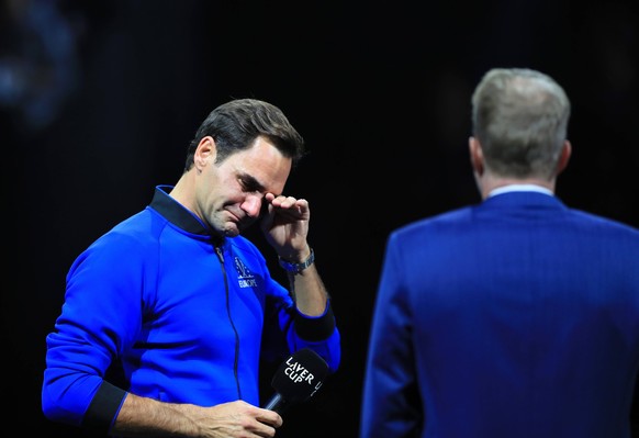 220924 -- LONDON, Sept. 24, 2022 -- Team Europe player Roger Federer L of Switzerland reacts at the end of his last match after announcing his retirement at the Laver Cup in London, Britain, Sept. 24, ...