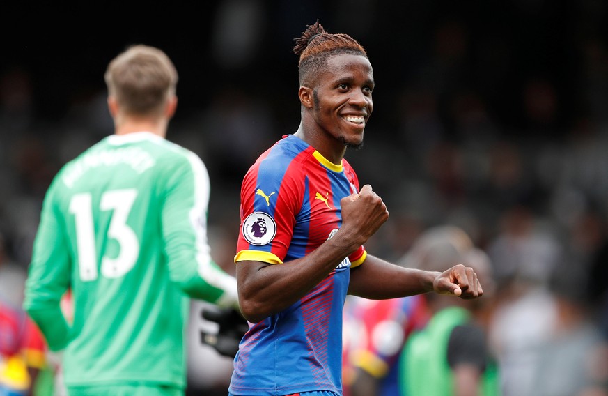 Soccer Football - Premier League - Fulham v Crystal Palace - Craven Cottage, London, Britain - August 11, 2018 Crystal Palace's Wilfried Zaha celebrates after the match Action Images via Reuters/John  ...