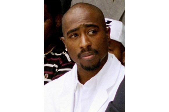 FILE - Rapper Tupac Shakur attends a voter registration event in South Central Los Angeles, Aug. 15, 1996. Authorities in Nevada confirmed Tuesday, July 18, 2023, that they served a search warrant thi ...