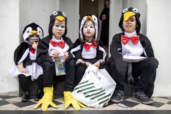 March 21, 2019 - London, UK, United Kingdom - Orthodox couple seen wearing fancy dresses during the festival of Purim on the streets of Stamford Hill in north London..Purim is one of the most entertai ...