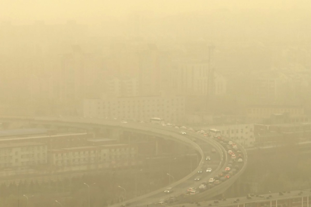 A view of a highway shot through a glass window during a dust storm in Beijing, Friday, March 10, 2023. Skyscrapers disappeared into the haze and air quality plummeted as China&#039;s capital was enve ...