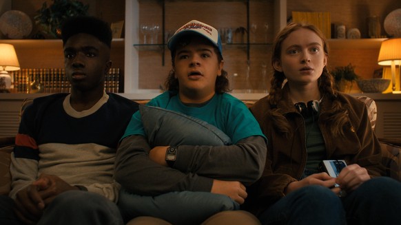 Stranger Things Season 4 2022 L to R Caleb McLaughlin as Lucas Sinclair, Gaten Matarazzo as Dustin Henderson and Sadie Sink as Max Mayfield in Stranger Things Season 4 2022 Photo credit: Netflix PUBLI ...