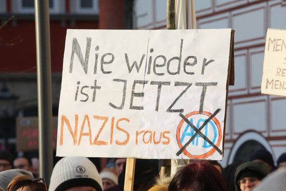 Anti AFD demonstration in Coburg, Germany - 21 Jan 2024 A placard reading Nazis out and never again means now is held high during a demonstration. Protesters and organizations such as the Greens and F ...