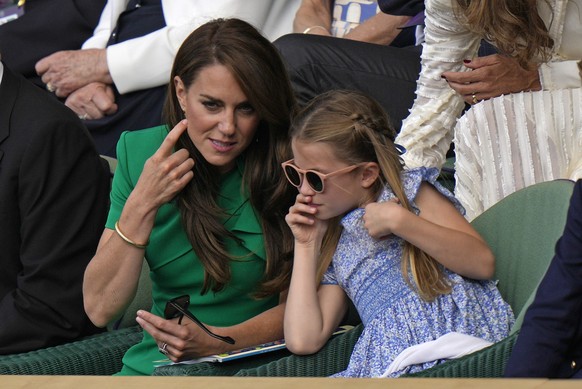 Kate, Princess of Wales chats with Princess Charlotte as they sit in the Royal Box on Centre Court for the final of the men&#039;s singles between Spain&#039;s Carlos Alcaraz and Serbia&#039;s Novak D ...