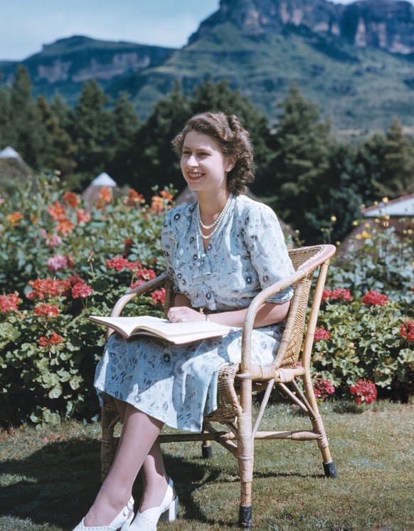 Britain&#039;s Princess Elizabeth, later Queen Elizabeth II, on her 21st birthday, seated in Natal National Park, South Africa, April 21, 1947. In the background are the Drakenberg Mountains. (AP Phot ...