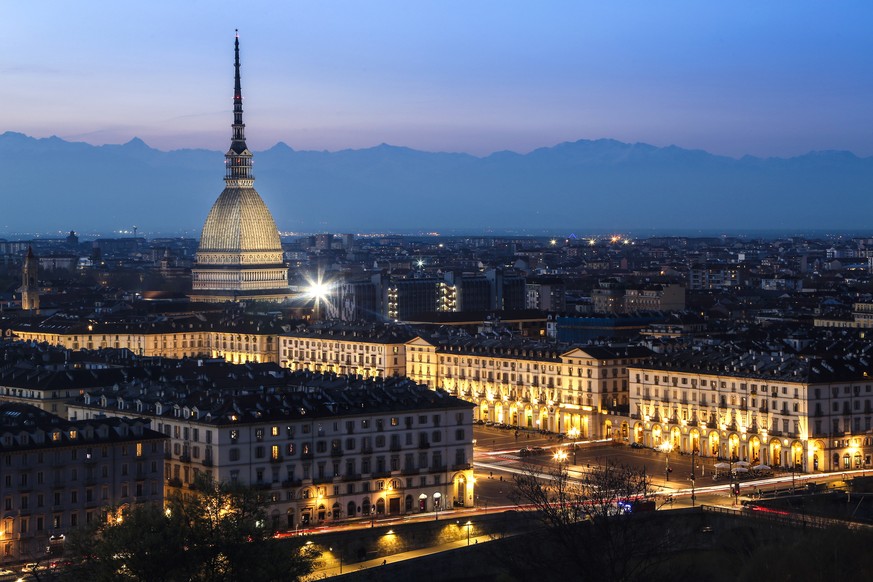 Piazza Vittorio Veneto, Mole Antonelliana and Alps at night in Turin, Italy
