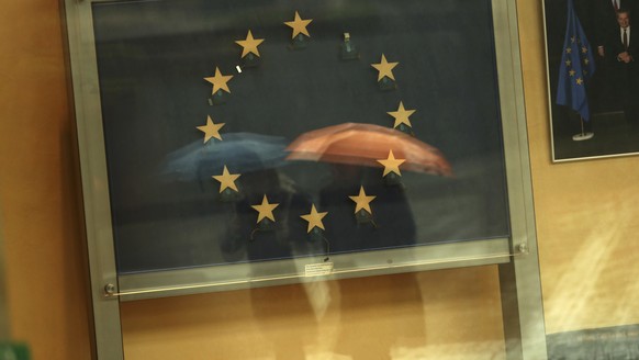 Passers-by are reflected in an artwork based on the European Union flag, with one star missing, in the European Commissions headquarters in Brussels, Monday, Nov. 12, 2018. Britain&#039;s European Uni ...