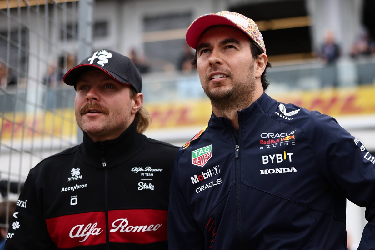 F1 Grand Prix Of Canada Valtteri Bottas of Alfa Romeo and Sergio Perez of Red Bull Racing before the drivers parade ahead the Formula 1 Grand Prix of Canada at Circuit Gilles Villeneuve in Montreal, C ...