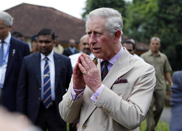 FILE - Britain's Prince Charles greets the crowd during a visit to the Peradeniya National Botanical Gardens in Kandy, Sri Lanka, Saturday, Nov. 16, 2013. Charles and his wife Camilla, the Duchess of  ...