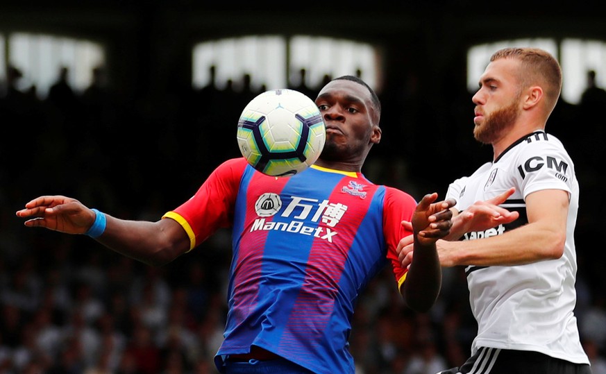 Soccer Football - Premier League - Fulham v Crystal Palace - Craven Cottage, London, Britain - August 11, 2018 Crystal Palace's Christian Benteke in action with Fulham's Calum Chambers REUTERS/Eddie K ...