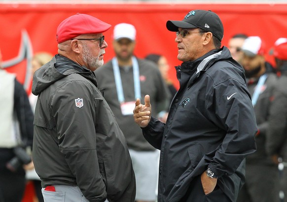 Carolina Panthers head coach Ron Rivera (right) and Tampa Bay Buccaneers head coach Bruce Arians chat ahead of an NFL International Series game at Tottenham Hotspur Stadium, Sunday, Oct. 13, 2019, in  ...