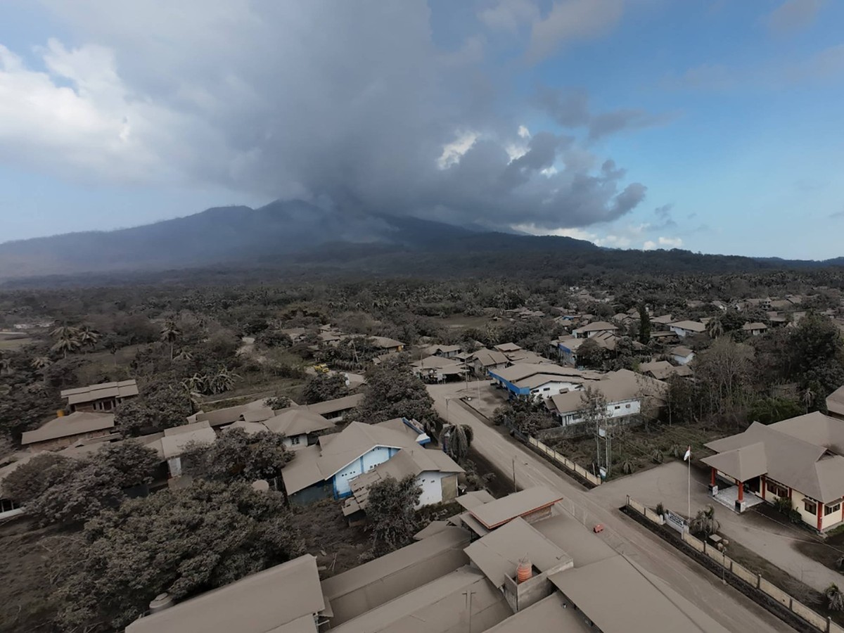 241111 -- BEIJING, Nov. 11, 2024 -- An aerial drone photo provided by the National Disaster Management Agency shows residential area covered by volcanic materials spewing from Mount Lewotobi Laki-Laki ...