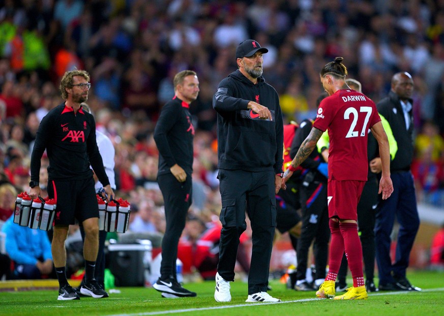 Liverpool v Crystal Palace - Premier League - Anfield Liverpool s Darwin Nunez right walks past manager Jurgen Klopp as he leaves the pitch after receiving a red card during the Premier League match a ...