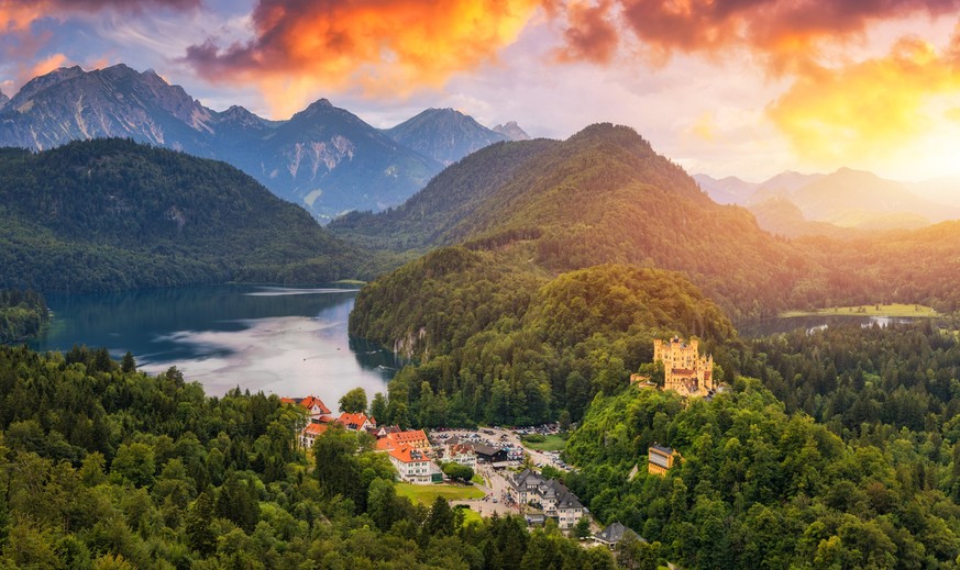 Hohenschwangau Castle near Fussen, Bavaria, Germany. Palace of king Ludwig II in Schwangau village. Schloss Hohenschwangau is landmark of German Alps. Hohenschwangau Castle and Alpsee in Schwangau.