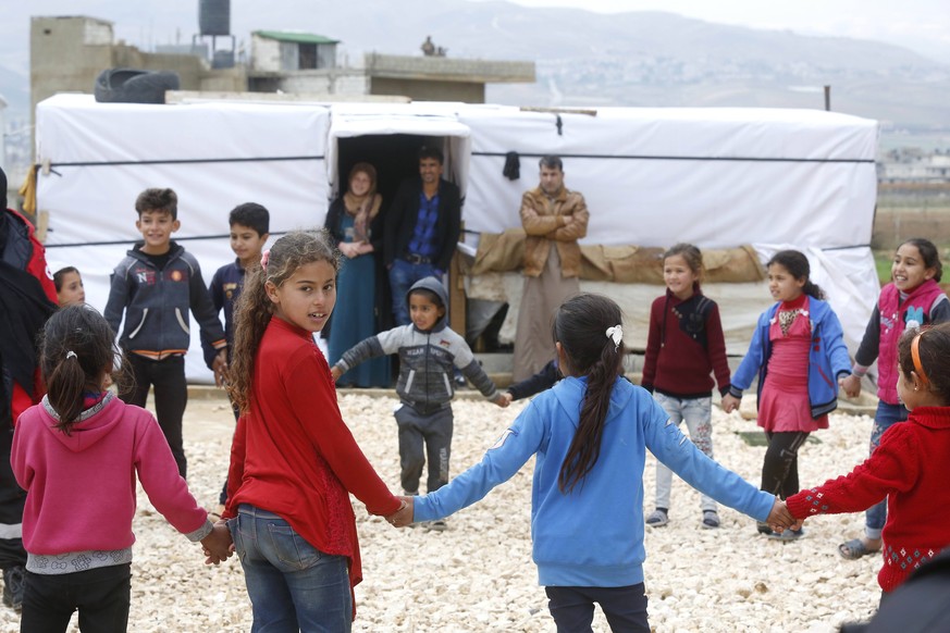 (181210) -- BAALBEK (LEBANON), Dec. 10, 2018 -- Syrian children play at a refugee camp near the Baalbek City in Lebanon s eastern Bekaa valley, Dec. 10, 2018. The Syrian refugees in the camp will endu ...