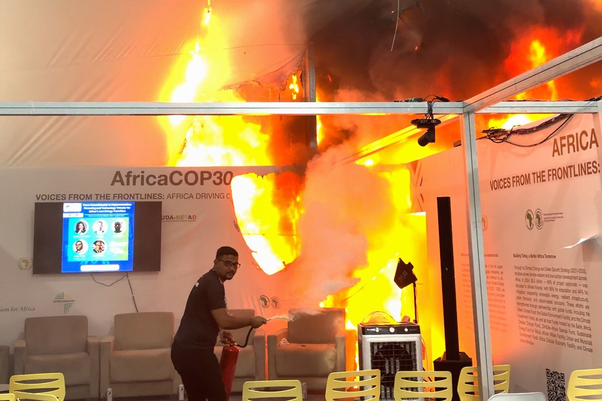 In this frame from video provided by Kevin Munyoli, flames engulf pavilions at the COP30 U.N. Climate Summit, Thursday, Nov. 20, 2025, in Belem, Brazil. (Kevin Munyoli via AP)