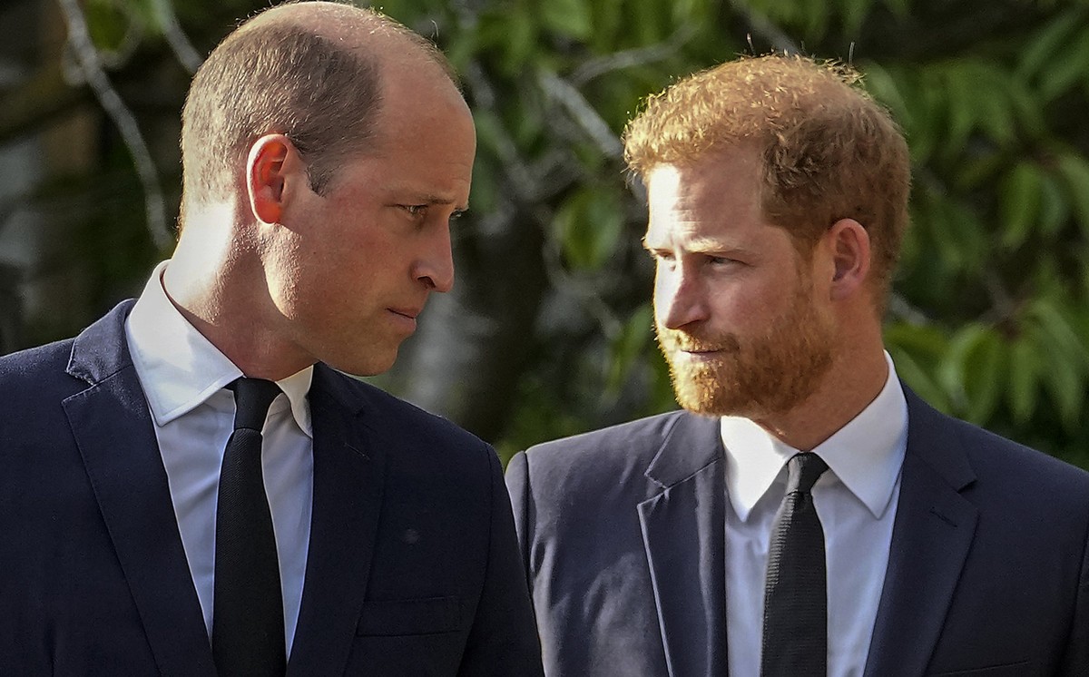FILE - Britain&#039;s Prince William and Britain&#039;s Prince Harry walk beside each other after viewing the floral tributes for the late Queen Elizabeth II outside Windsor Castle, in Windsor, Englan ...