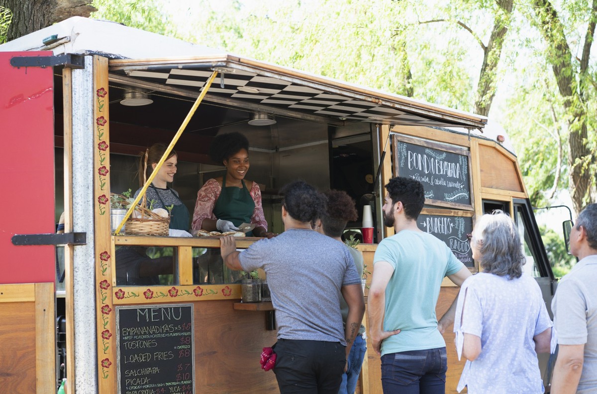 people working in a food truck