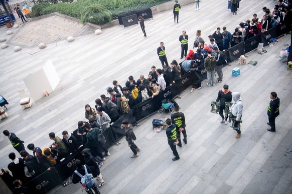 September 20, 2019, Taiyuan, Shanxi, China: Consumers line up to buy the newly-released Adidas Yeezy, a collaboration between German sportswear brand Adidas and American rapper Kanye West, at an Adida ...