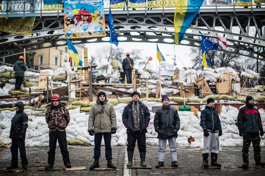 KIEV, UKRAINE - JANUARY 24: Anti-government protestors add tyres to a barricade near Dynamo Stadium on January 24, 2014 in Kiev, Ukraine. Talks to resolve the political stalemate in the Ukraine have f ...