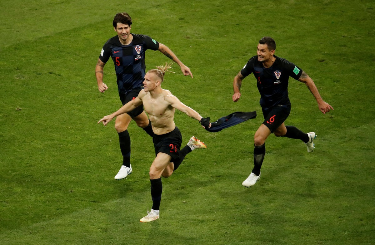FILE PHOTO: Soccer Football - World Cup - Quarter Final - Russia vs Croatia - Fisht Stadium, Sochi, Russia - July 7, 2018 Croatia's Domagoj Vida celebrates their second goal with Vedran Corluka a ...