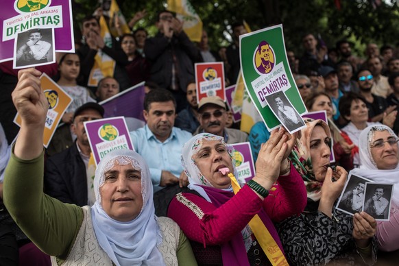 ISTANBUL, TURKEY - MAY 04: Supporters of the Pro-Kurdish Peoples&#039; Democratic Party (HDP) shout slogans and hold pictures of HDP&#039;s nominated presidential candidate Selahattin Demirtas who is  ...