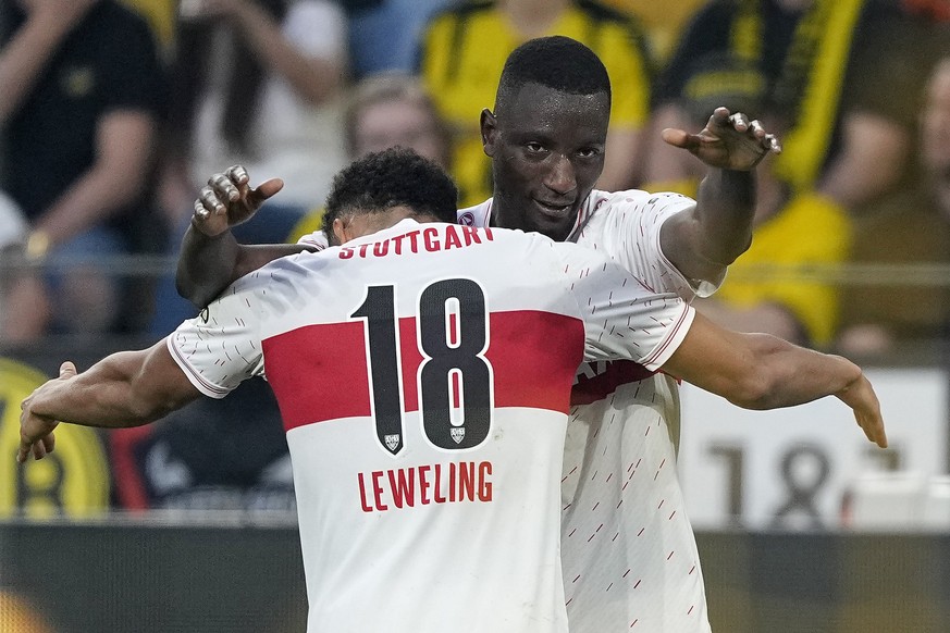 Stuttgart&#039;s Serhou Guirassy celebrates with Stuttgart&#039;s Jamie Leweling, left, after scoring the opening goal during the German Bundesliga soccer match between Borussia Dortmund and VfB Stutt ...