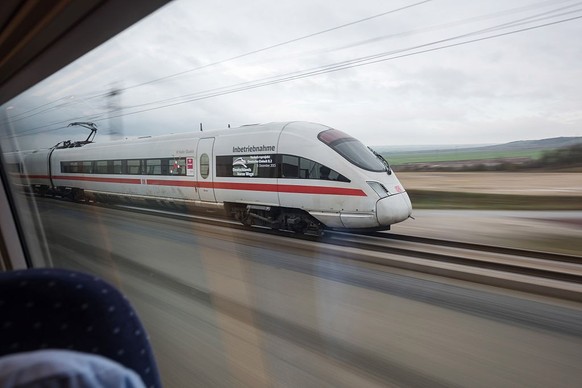 ERFURT, GERMANY - DECEMBER 9: A high-speed ICE train of German state rail carrier Deutsche Bahn travels on the newly-completed stretch between Erfurt and Leipzig on December 9, 2015 near Erfurt, Germa ...
