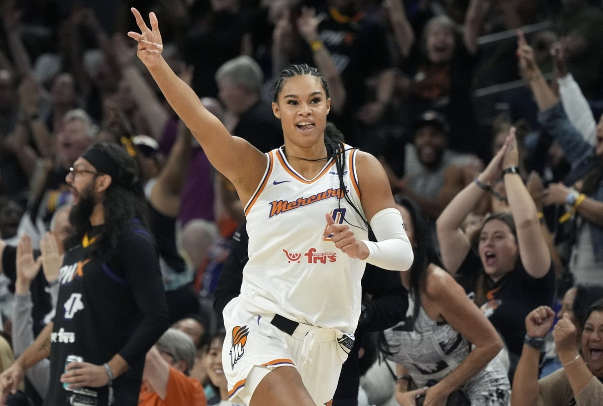 Phoenix Mercury forward Satou Sabally celebrates a 3-pointer by Mercury's Lexi Held during the second half of a WNBA basketball game against the Golden State Valkyries Thursday, June 5, 2025, in ...