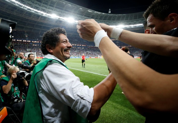 Soccer Football - World Cup - Semi Final - Croatia v England - Luzhniki Stadium, Moscow, Russia - July 11, 2018 Croatia&#039;s Mario Mandzukic celebrates next to an AFP photographer Yuri Cortez after  ...