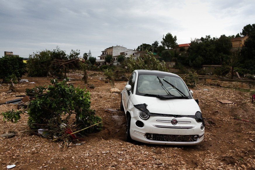A car on a destroyed crop after flooding in Sant Llorenc, 60 kilometers (40 miles) east of Mallorca's capital, Palma, Spain, Wednesday, Oct. 10, 2018. Torrential rainstorms that caused flash flooding  ...