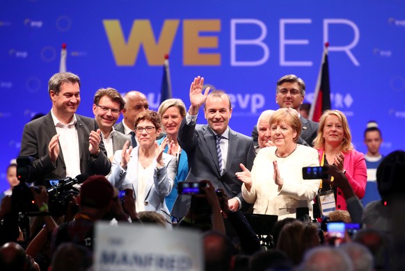 Manfred Weber, candidate of the European People&#039;s Party (EPP) for the next European Commission President, stands next to German Chancellor Angela Merkel, Annegret Kramp-Karrenbauer, Chairwoman of ...