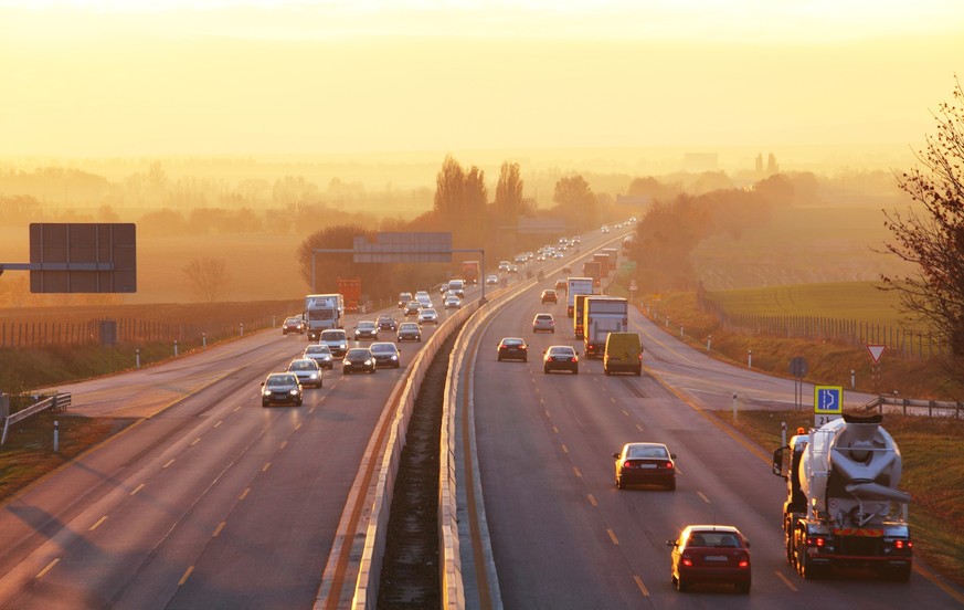 Traffic on highway with cars.