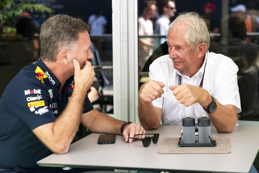 Red Bull Racing team chief Christian Horner speaks with Red Bull consultant Helmut Marko in the paddock during the Formula One Grand Prix of the United States at the Circuit of The Americas in Austin, ...