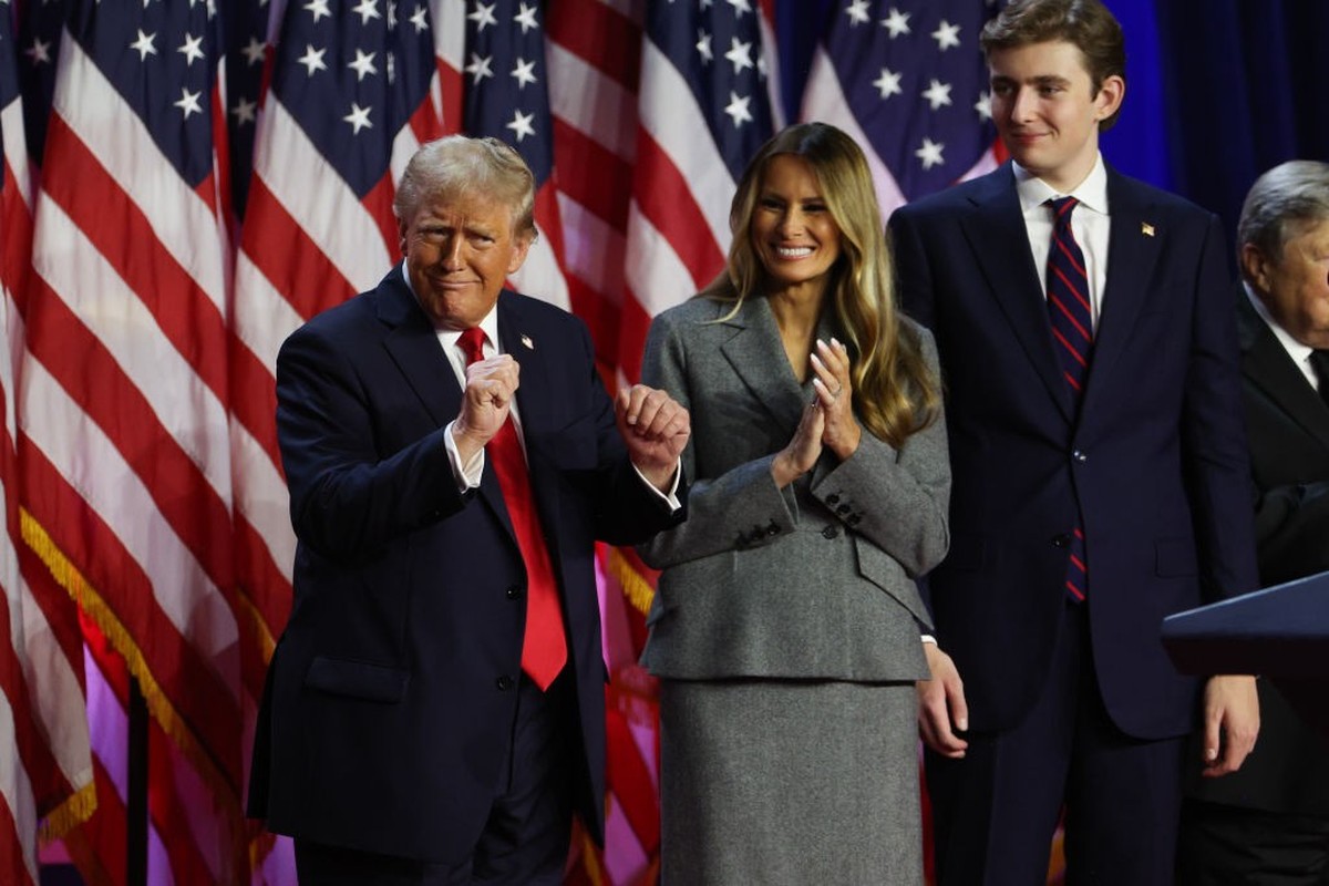 WEST PALM BEACH, FLORIDA - NOVEMBER 06: Republican presidential nominee, former U.S. President Donald Trump dances on stage with former first lady Melania Trump and Barron Trump during an election nig ...