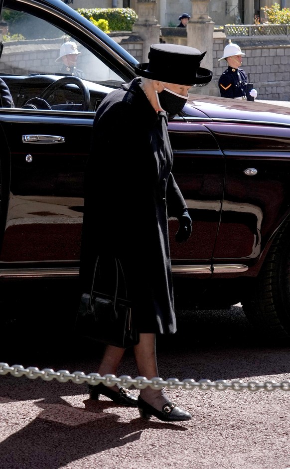 WINDSOR, ENGLAND - APRIL 17: Queen Elizabeth II arrives for the funeral of her husband Prince Philip, Duke of Edinburgh at St George's Chapel at Windsor Castle on April 17, 2021 in Windsor, England. P ...