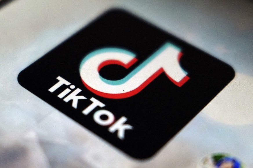 FILE - A view of the TikTok app logo is pictured in Tokyo, Sept. 28, 2020. Young voters are increasingly using the app to learn about politics, elections and issues, and candidates are taking notice.  ...