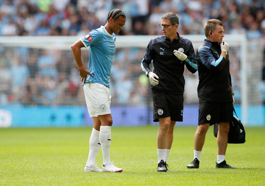 Soccer Football - FA Community Shield - Manchester City v Liverpool - Wembley Stadium, London, Britain - August 4, 2019 Manchester City's Leroy Sane is substituted after sustaining an injury REUTERS/D ...
